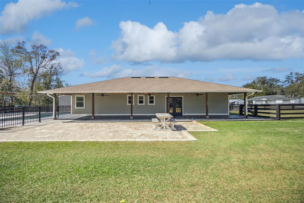 323 McLain Lane Geneva, FL 32732 - Photo 33 of 70 front view of a house with swimming pool and a yard