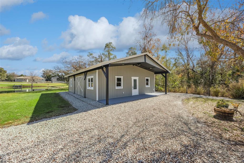 323 McLain Lane Geneva, FL 32732 - Photo 38 of 70 a front view of a house with a yard and garage