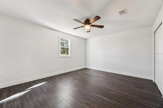 an aerial view of a house with a swimming pool