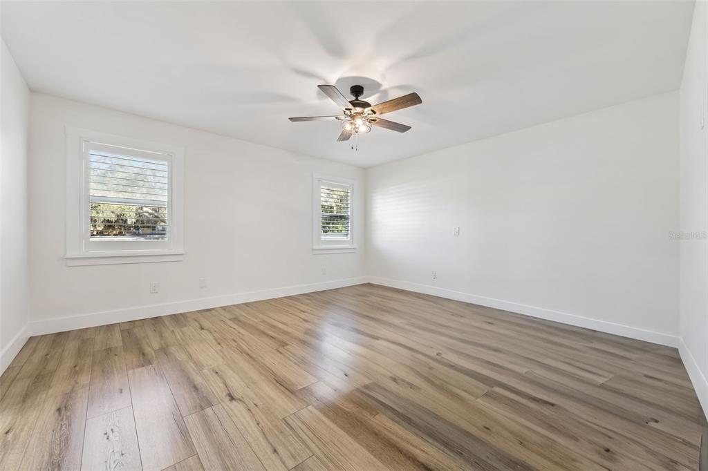 323 McLain Lane Geneva, FL 32732 - Photo 44 of 70 wooden floor in an empty room with a window