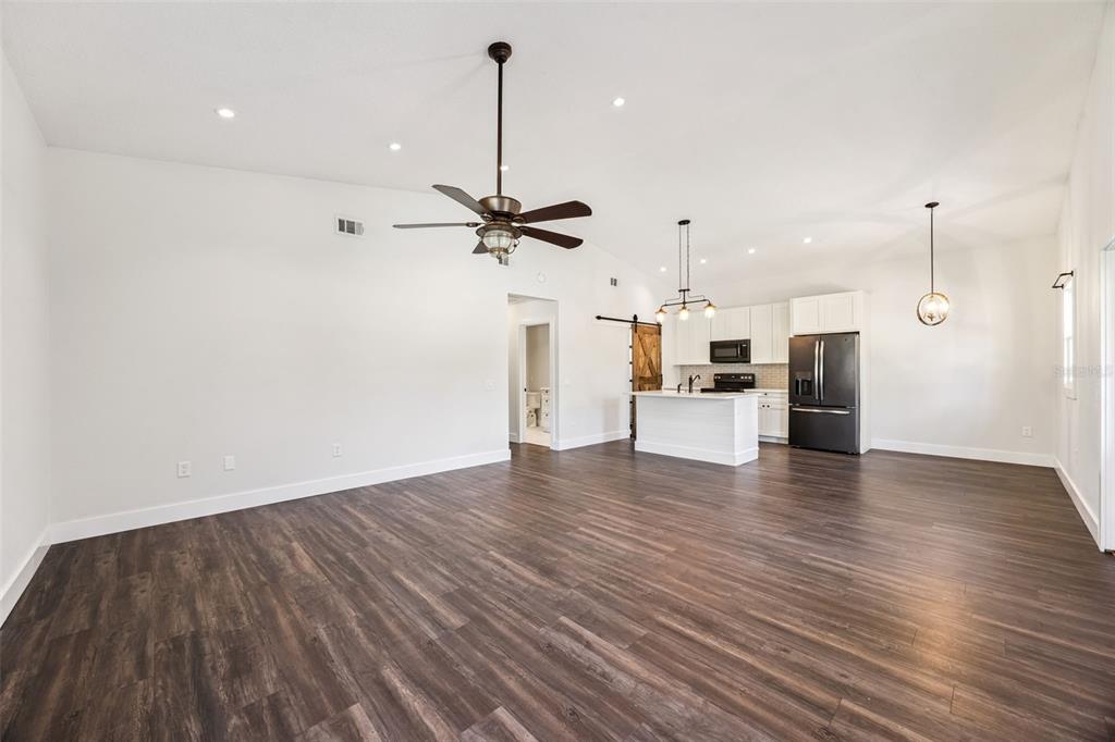 323 McLain Lane Geneva, FL 32732 - Photo 45 of 70 a view of a kitchen with a sink and a refrigerator