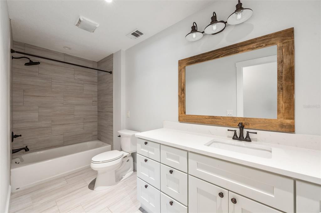 323 McLain Lane Geneva, FL 32732 - Photo 46 of 70 a bathroom with a toilet sink double vanity and bathtub