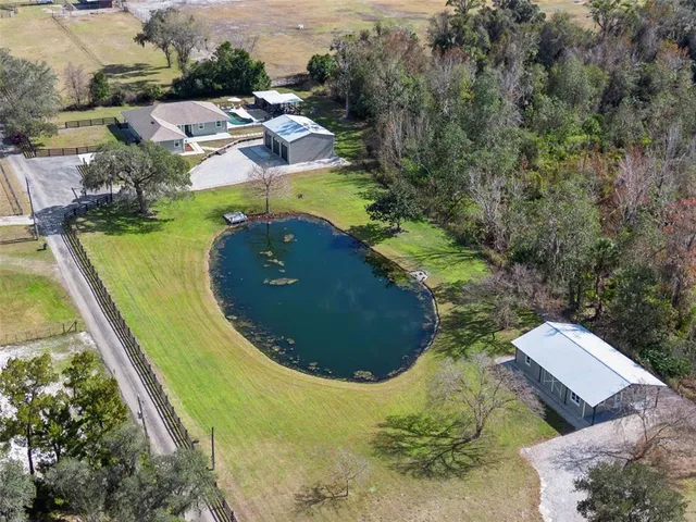a view of a swimming pool and an outdoor seating
