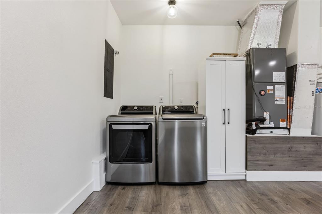 323 McLain Lane Geneva, FL 32732 - Photo 52 of 70 a kitchen with stainless steel appliances a refrigerator and a stove