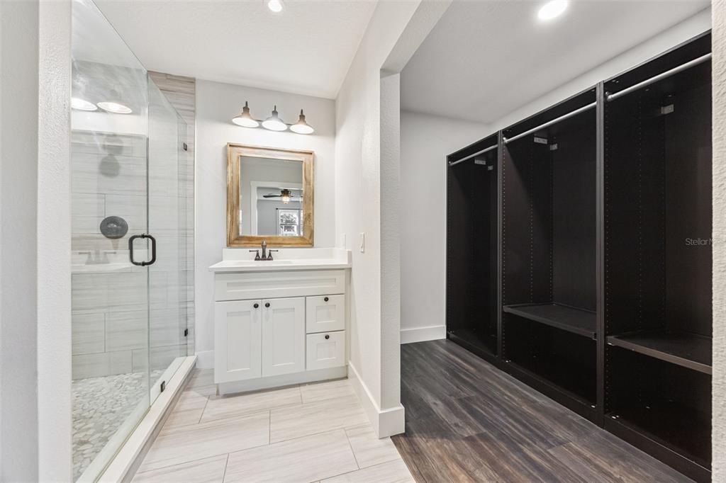 323 McLain Lane Geneva, FL 32732 - Photo 56 of 70 a bathroom with a shower sink and mirror