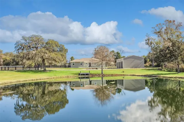 a view of a lake with a big yard