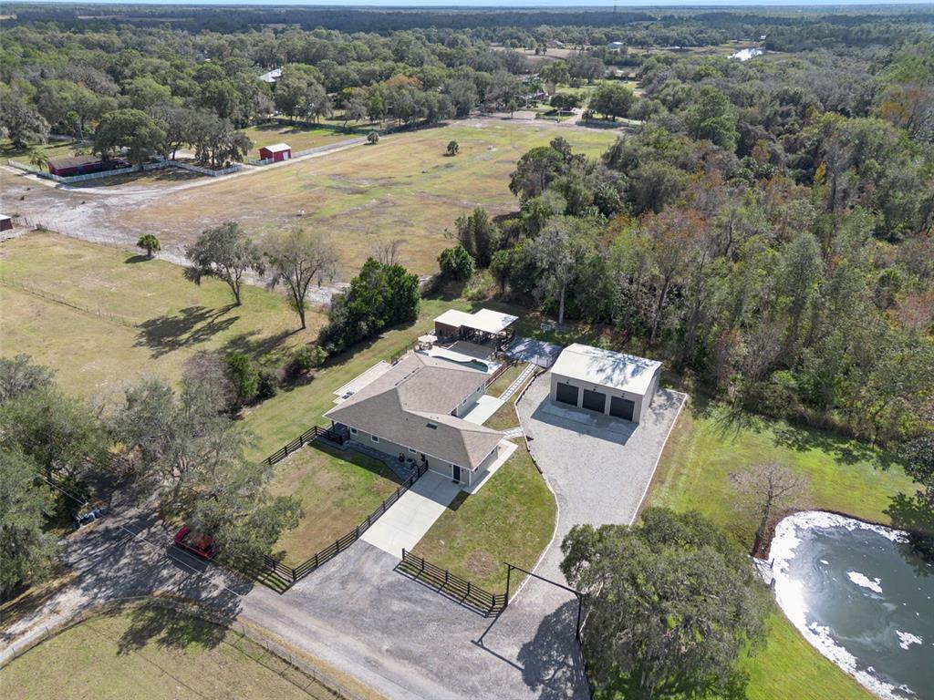 323 McLain Lane Geneva, FL 32732 - Photo 62 of 70 an aerial view of a house with a yard and lake view