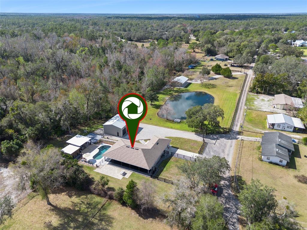 323 McLain Lane Geneva, FL 32732 - Photo 63 of 70 an aerial view of a house with a swimming pool