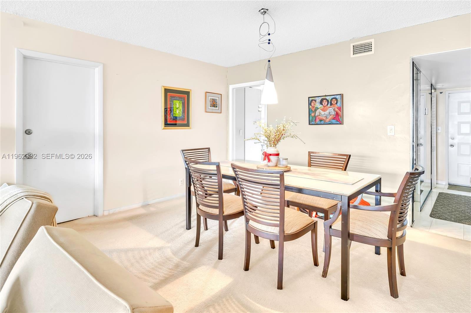 3510 Oaks Way, Unit 408 Pompano Beach, FL 33069 - Photo 12 of 27 a view of a dining room with furniture