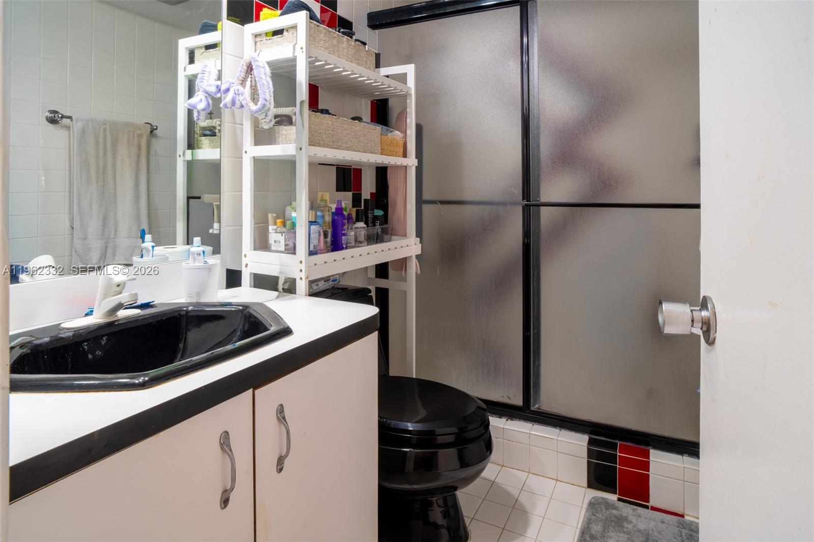 3510 Oaks Way, Unit 408 Pompano Beach, FL 33069 - Photo 18 of 27 a kitchen with a sink and a refrigerator