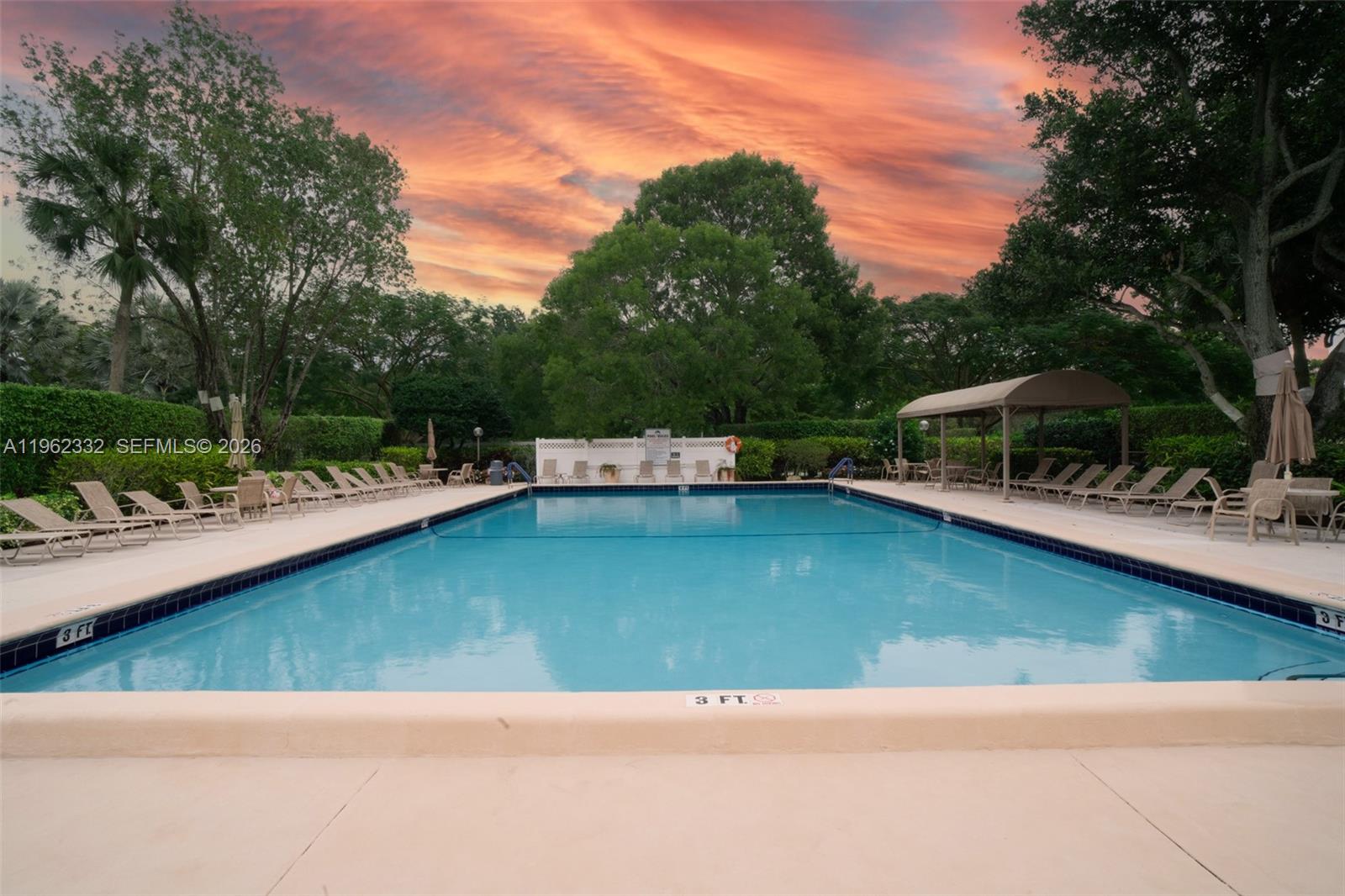 3510 Oaks Way, Unit 408 Pompano Beach, FL 33069 - Photo 26 of 27 a view of a lake with a house