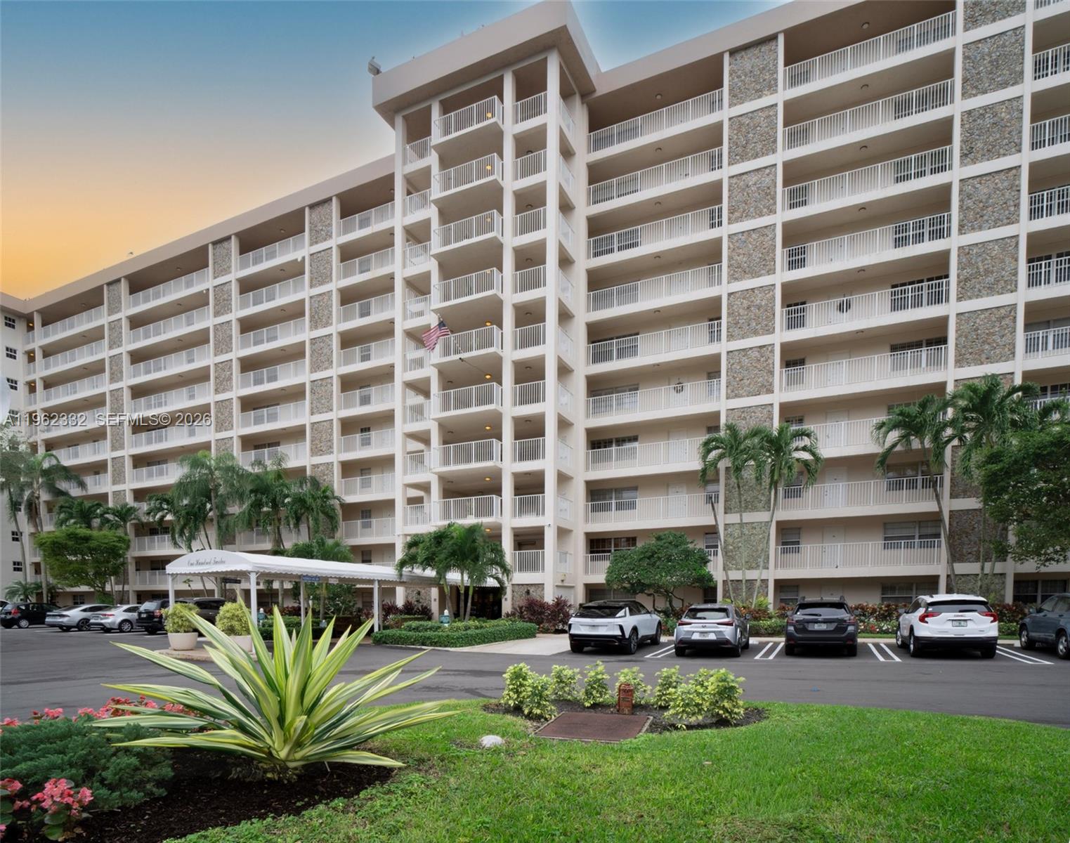 3510 Oaks Way, Unit 408 Pompano Beach, FL 33069 - Photo 3 of 27 a view of a building with garden