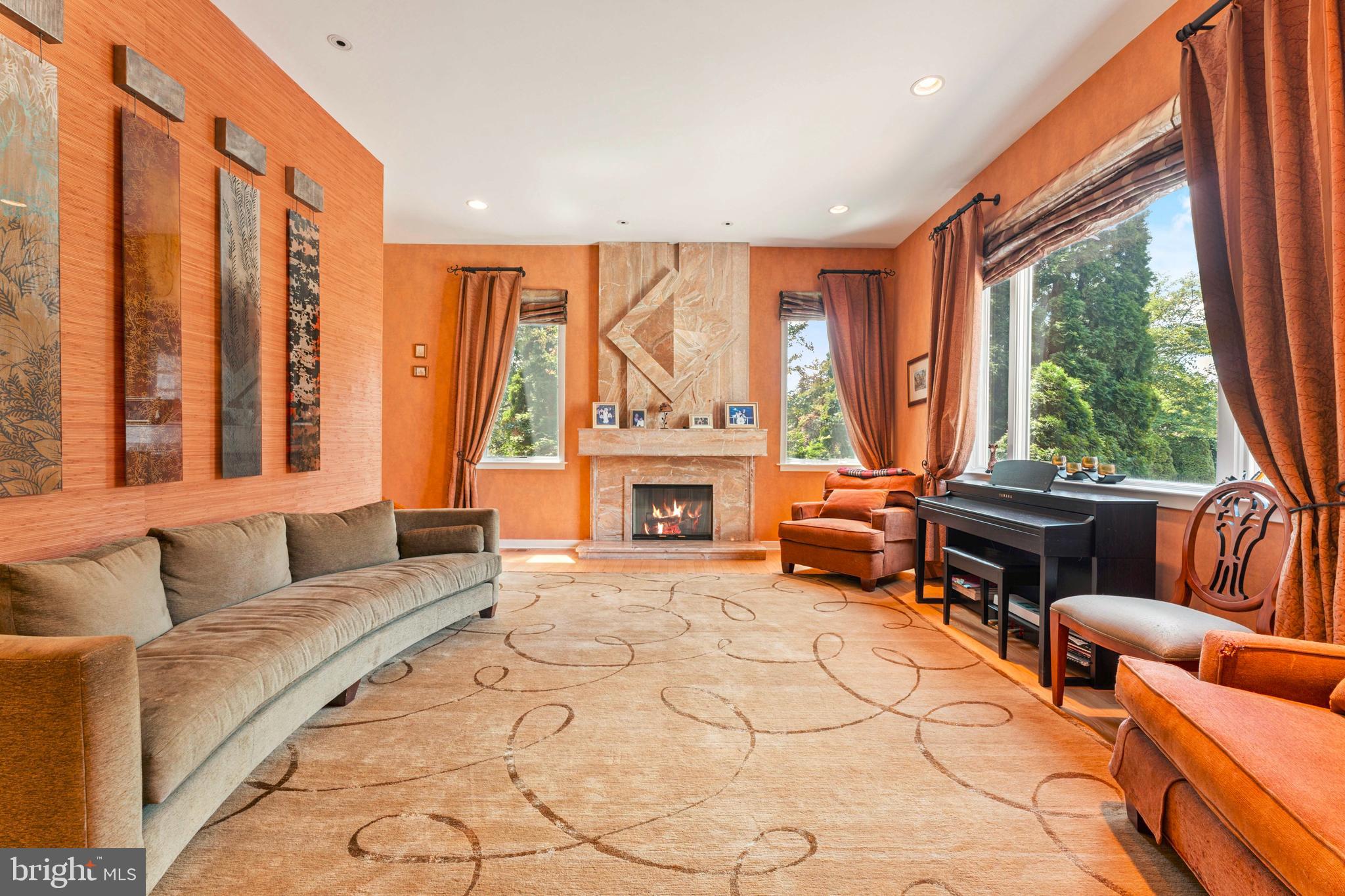 1427 Byberry Road Huntingdon Valley, PA 19006 - Photo 12 of 46 a living room with furniture fireplace and a large window