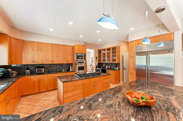 a view of a backyard with plants and outdoor seating