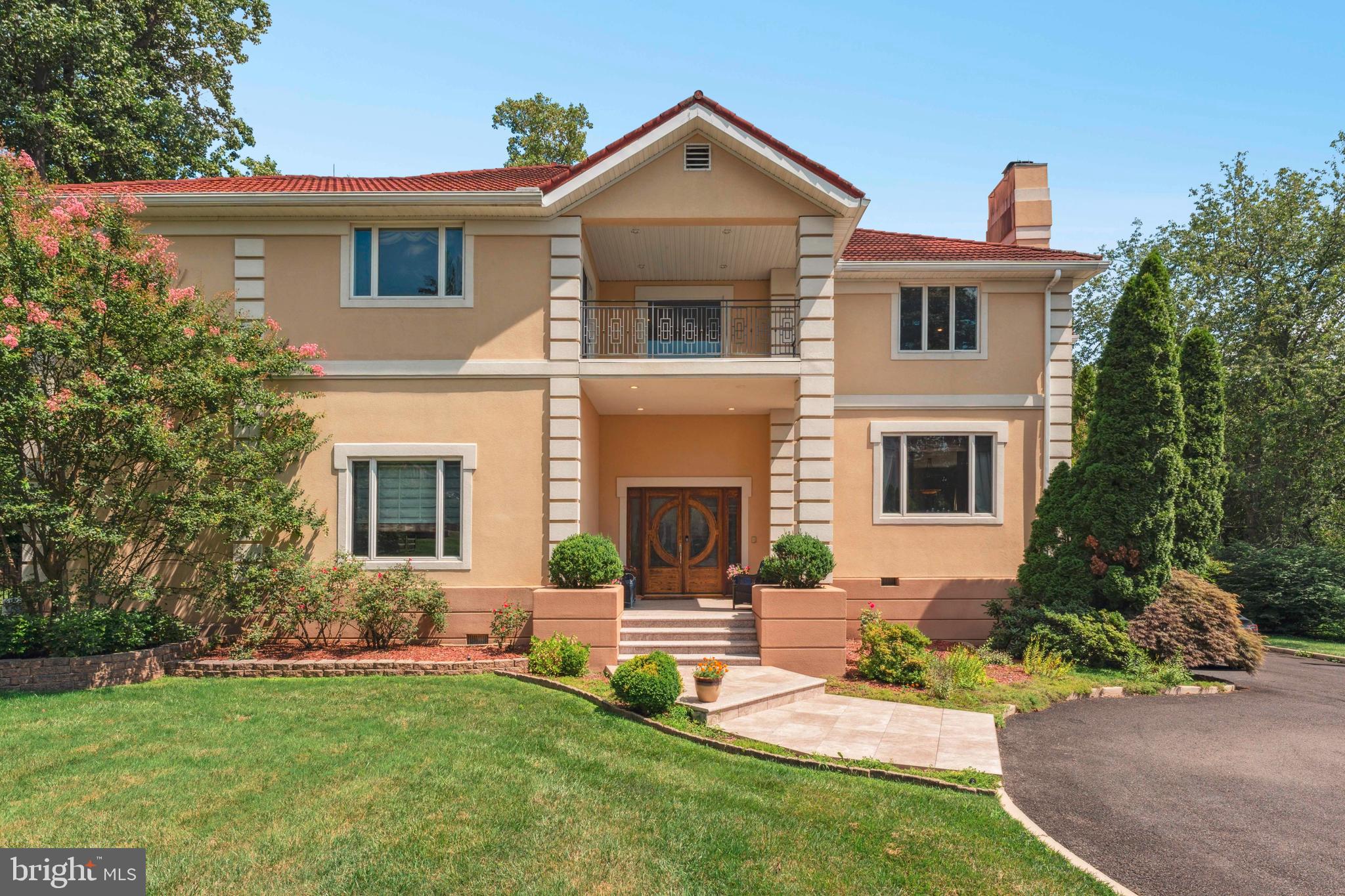 1427 Byberry Road Huntingdon Valley, PA 19006 - Photo 2 of 46 a front view of a house with a yard and garage