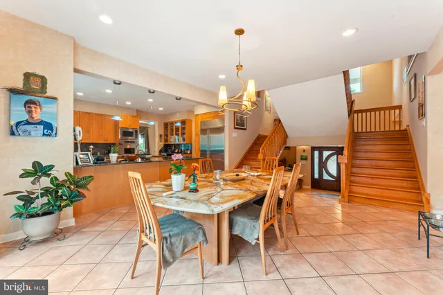 a white house that has tree in front of it