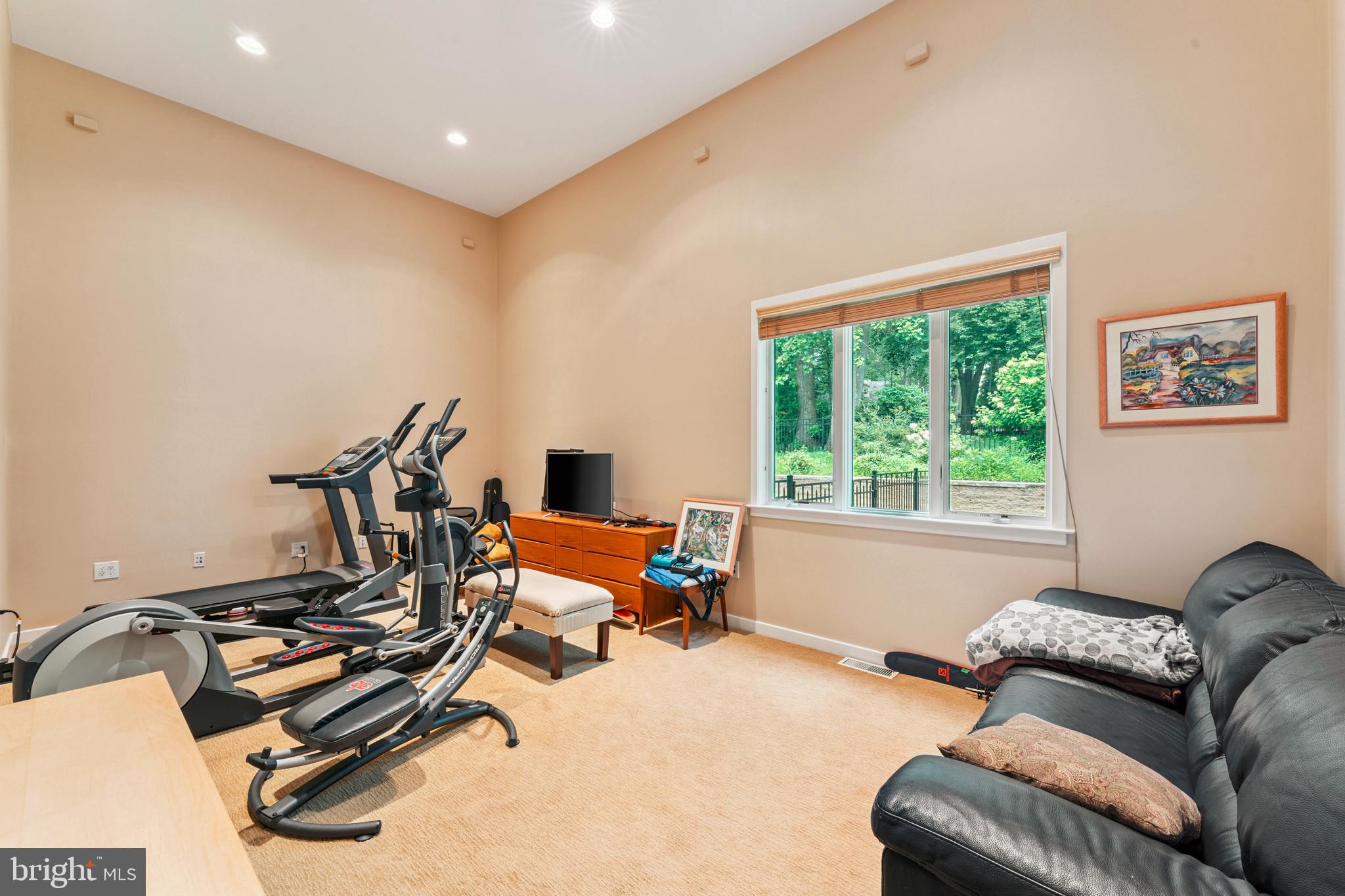 1427 Byberry Road Huntingdon Valley, PA 19006 - Photo 10 of 46 a living room with furniture gym equipment and a window