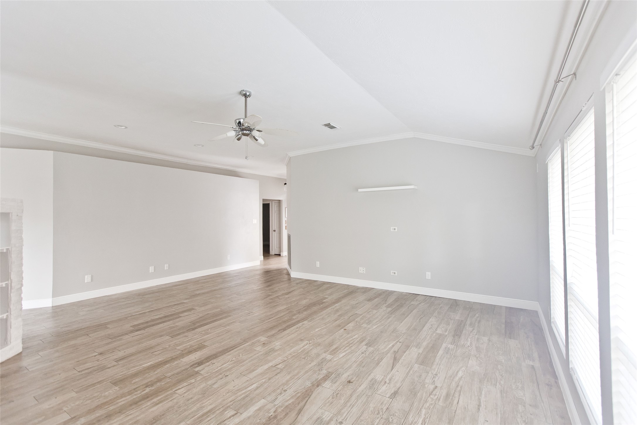 5807 Walkabout Way Katy, TX 77450 - Photo 13 of 25 wooden floor in an empty room with a window
