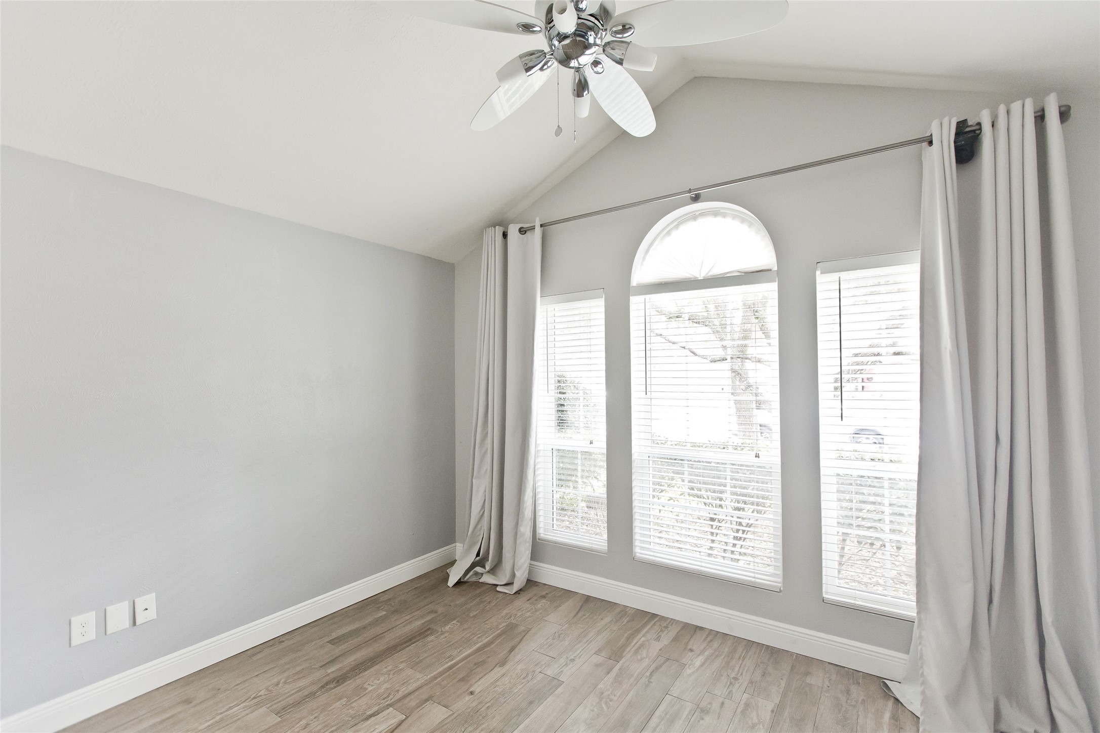 5807 Walkabout Way Katy, TX 77450 - Photo 15 of 25 wooden floor in an empty room with a window
