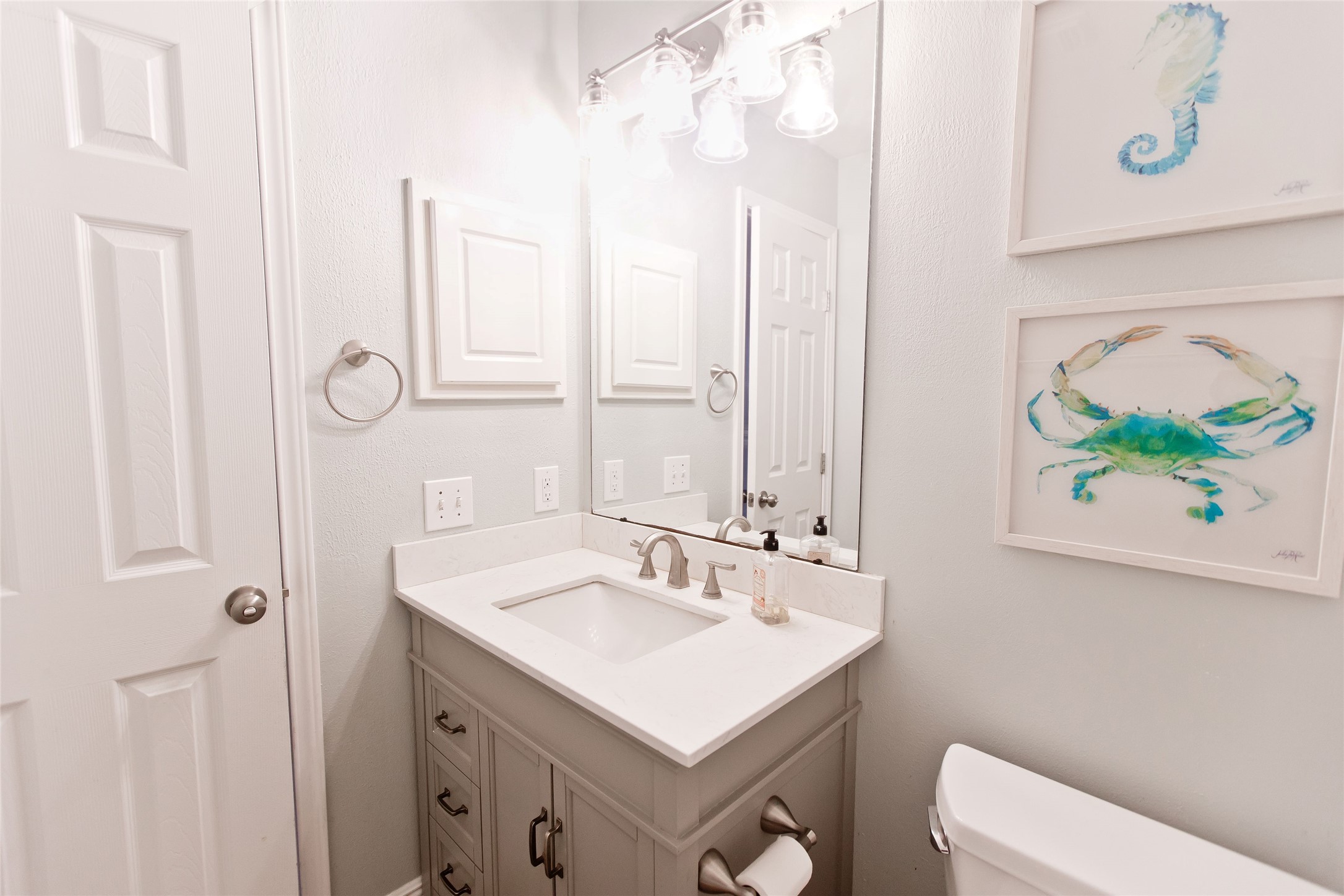 5807 Walkabout Way Katy, TX 77450 - Photo 18 of 25 a bathroom with a sink and a mirror