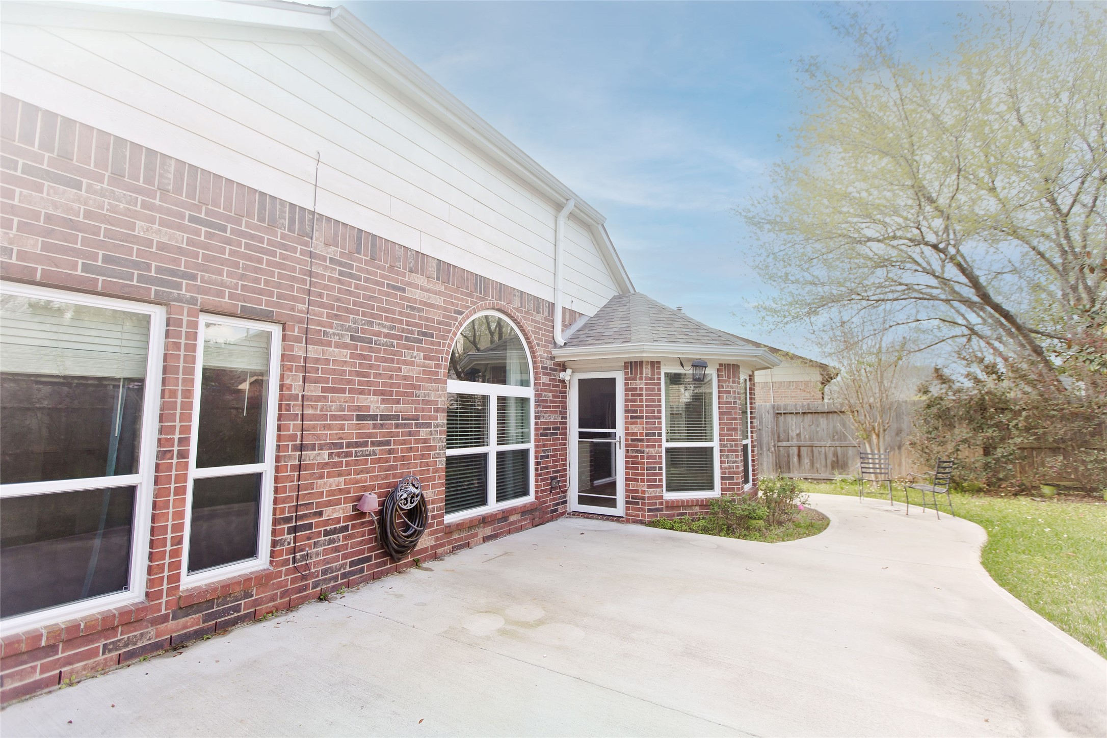 5807 Walkabout Way Katy, TX 77450 - Photo 25 of 25 a view of a brick house with a large windows