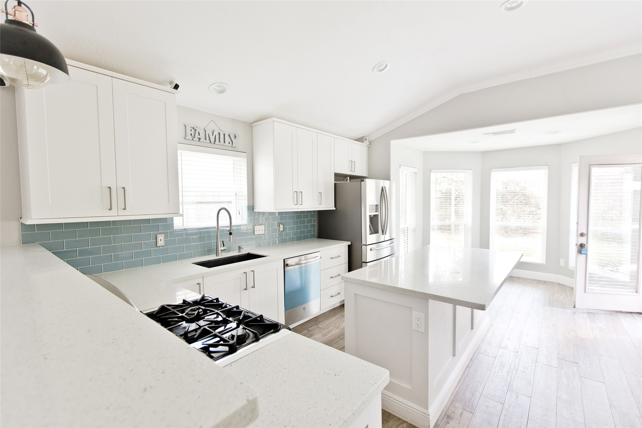 5807 Walkabout Way Katy, TX 77450 - Photo 5 of 25 a kitchen with stainless steel appliances kitchen island granite countertop a sink stove and refrigerator