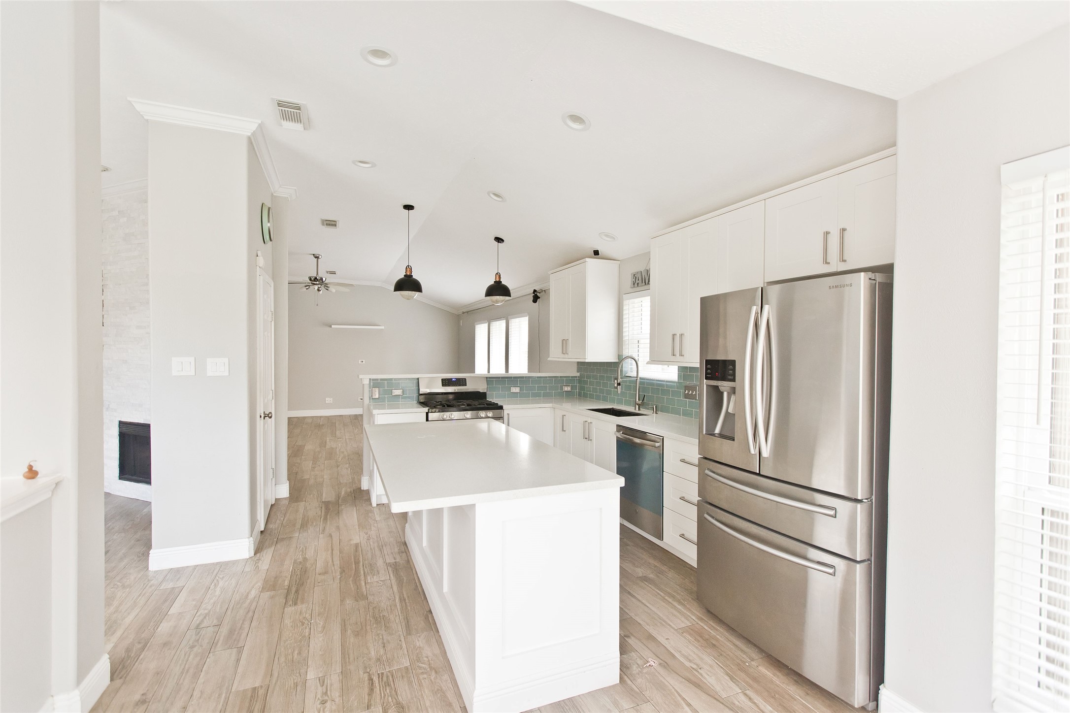 5807 Walkabout Way Katy, TX 77450 - Photo 7 of 25 a kitchen with stainless steel appliances a refrigerator and a stove top oven