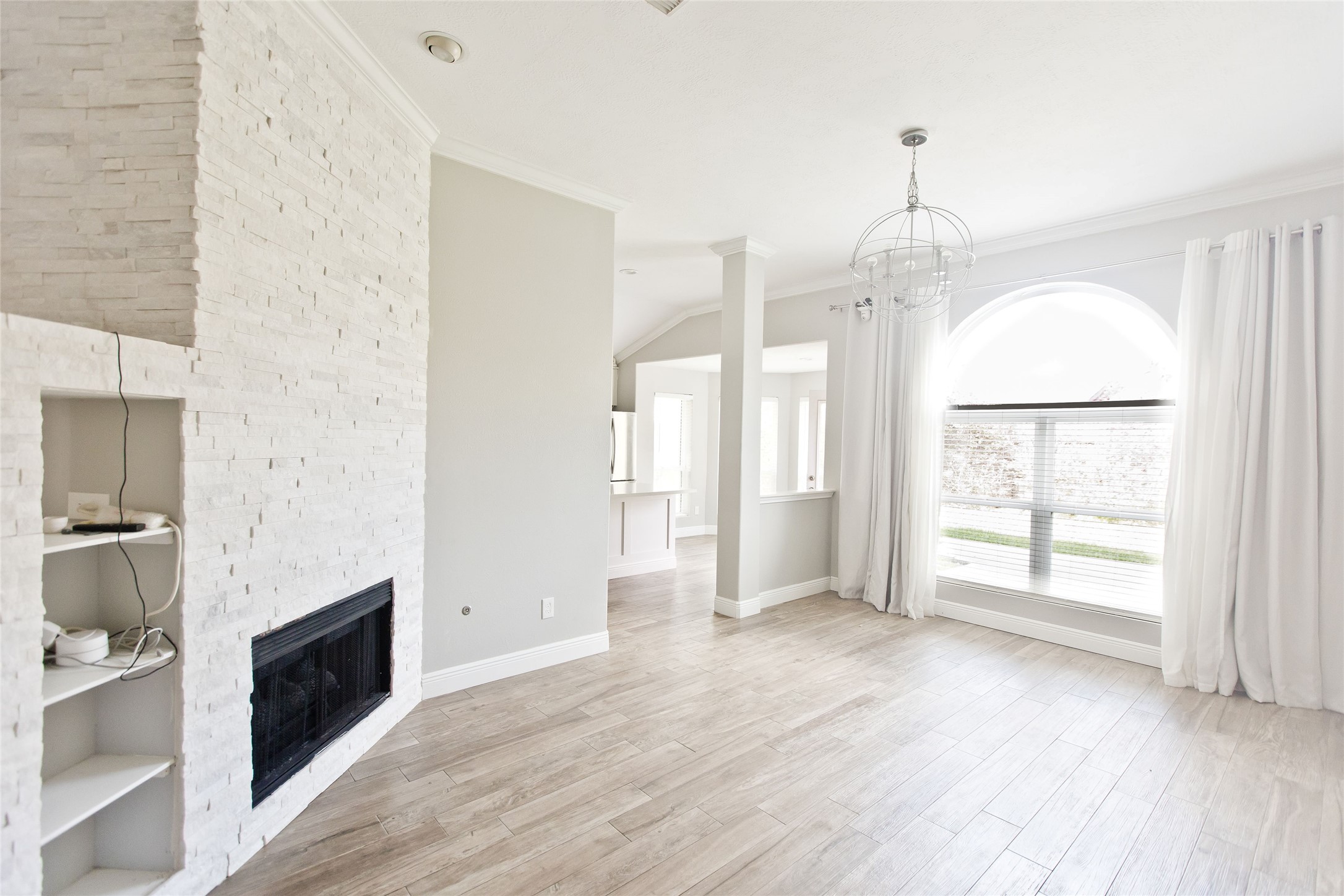 5807 Walkabout Way Katy, TX 77450 - Photo 9 of 25 a view of an empty room with wooden floor and a window