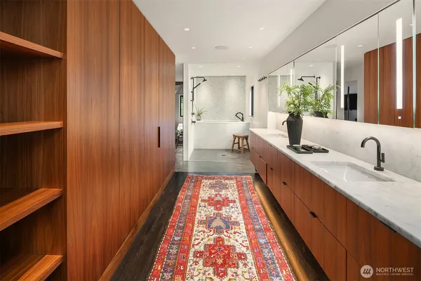 a large hall with wooden floor and windows