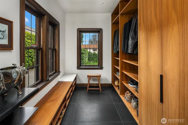 a view of a balcony with furniture and windows