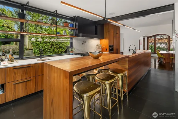 a view of a dining table and chairs