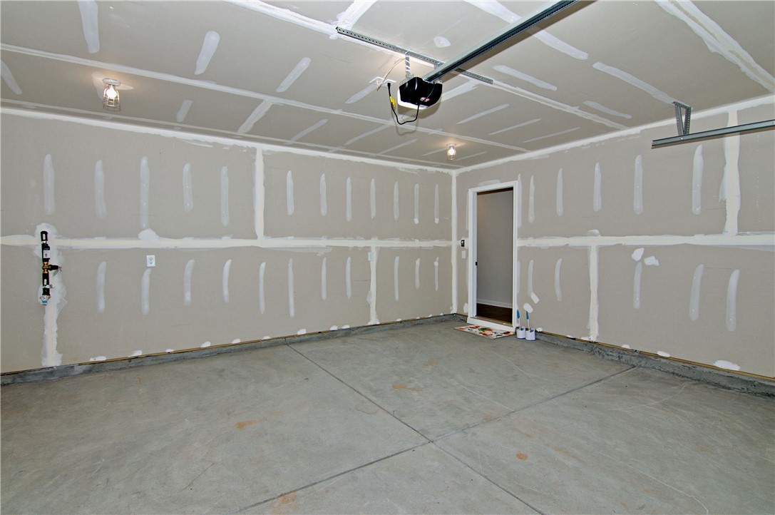 723 Peridot Way Westminster, SC 29693 - Photo 36 of 45 Ready for customization, this spacious garage offers ample room and direct interior access.