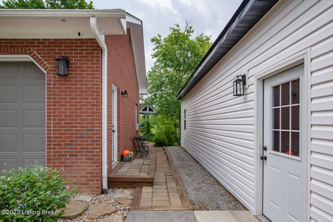 11365 Boston Road Boston, KY 40107 - Photo 32 of 93 walk way between the garage and house