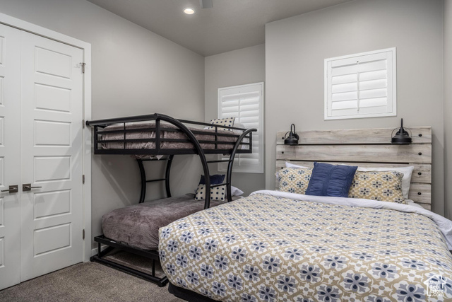 2600 Ocotillo Way, Unit 34 Santa Clara, UT 84765 - Photo 24 of 43 Bedroom with carpet flooring, a closet, and a ceiling fan