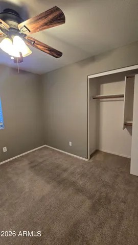 a bathroom with a granite countertop toilet sink and shower