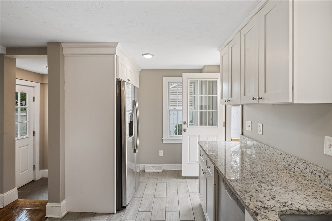 4717 Flat River Road Coventry, RI 02827 - Photo 9 of 28 kitchen leading to deck