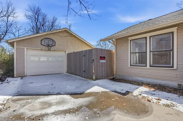 an empty room with windows & dryer