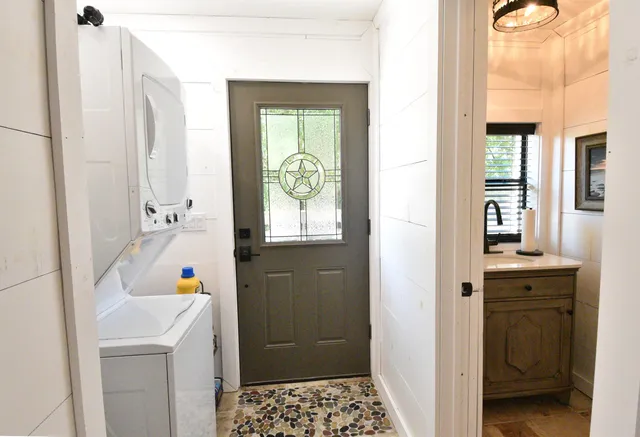 a bathroom with a sink a toilet and a shower