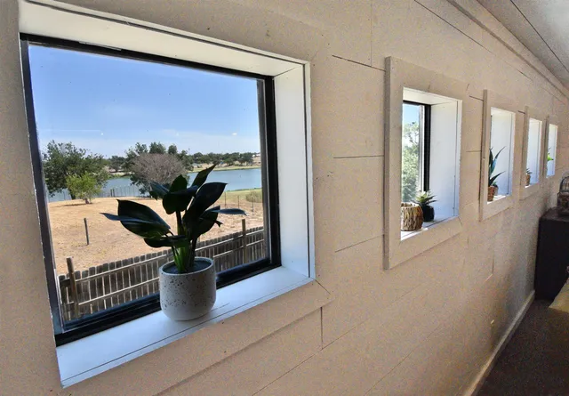 a view of a living room and a potted plant