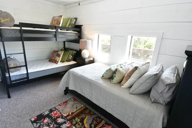 a bedroom with bed and a window