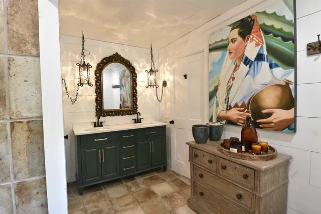 a bathroom with a sink and mirror