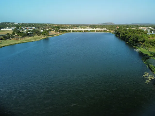 a view of lake with green space