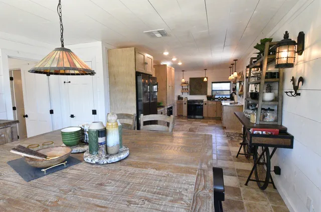 a living room with lots of furniture and a chandelier