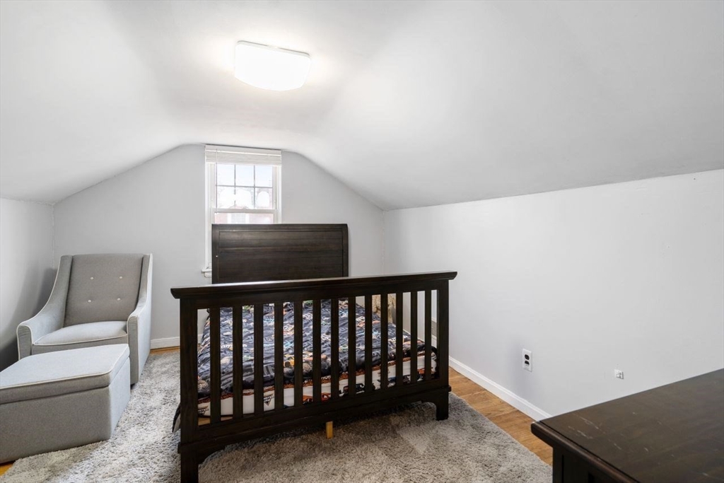68 Sutcliffe Road Lynn, MA 01904 - Photo 11 of 15 a bedroom with furniture and a window
