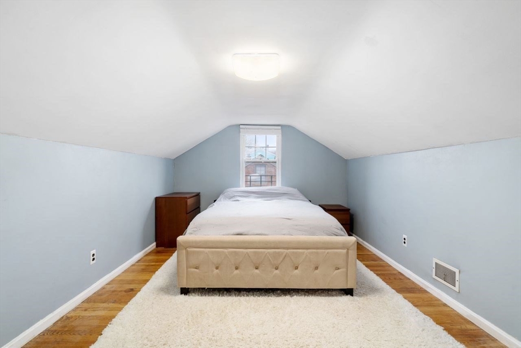 68 Sutcliffe Road Lynn, MA 01904 - Photo 13 of 15 a spacious bedroom with a bed and window