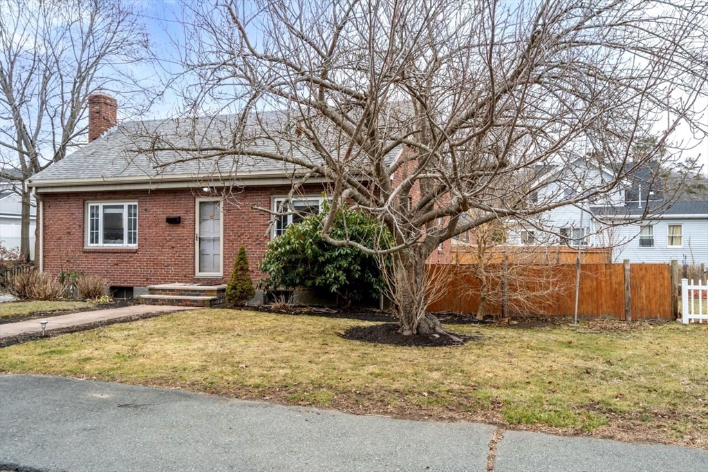 68 Sutcliffe Road Lynn, MA 01904 - Photo 15 of 15 a house with trees in front of it