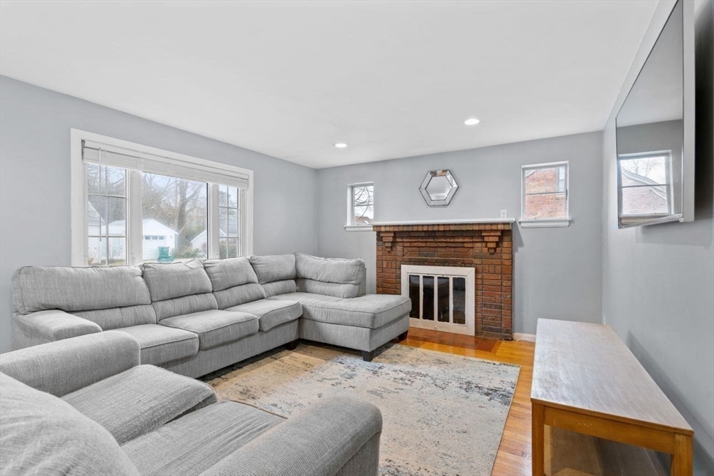 68 Sutcliffe Road Lynn, MA 01904 - Photo 7 of 15 a living room with furniture and a fireplace