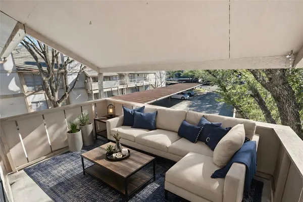 a living room with furniture and a rug