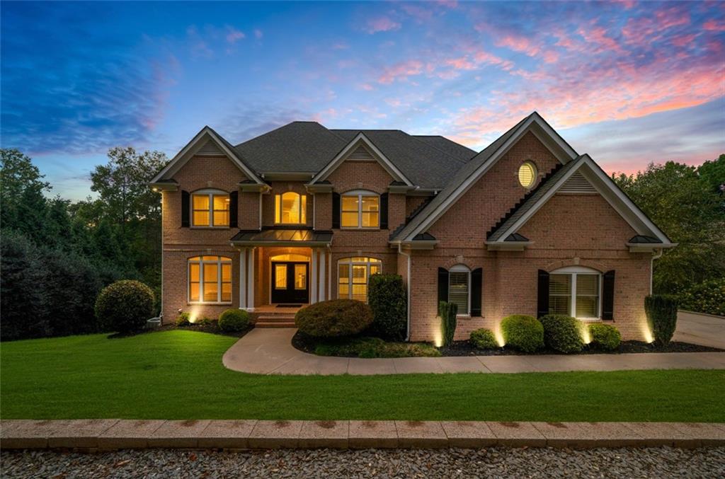 a front view of a house with a yard