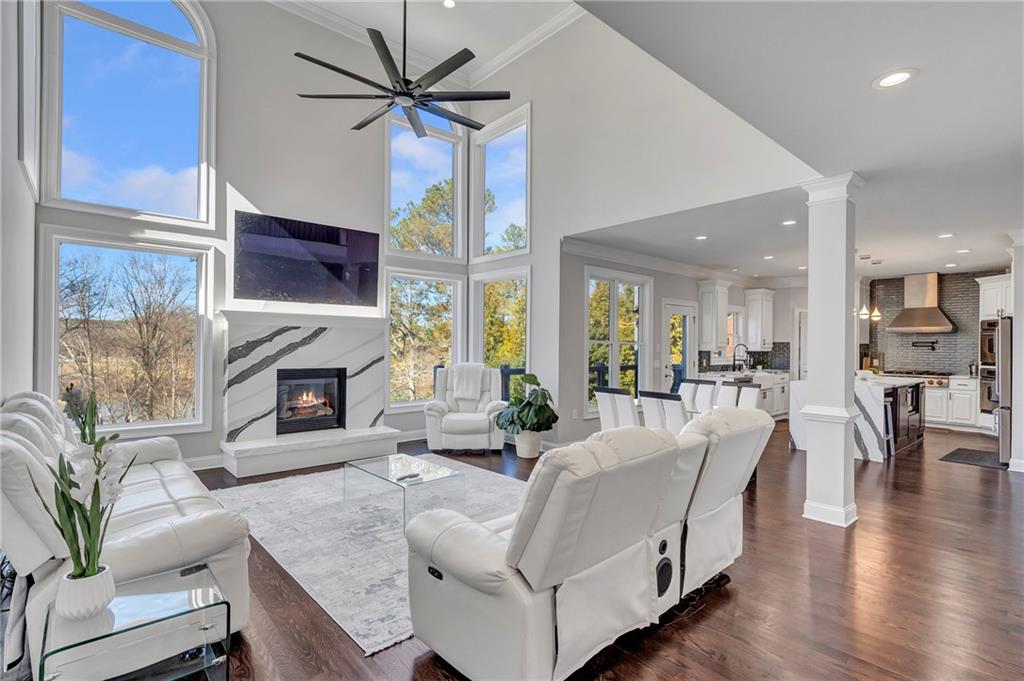 5755 Riley Road Cumming, GA 30028 - Photo 11 of 77 a living room with furniture a fireplace and a flat screen tv